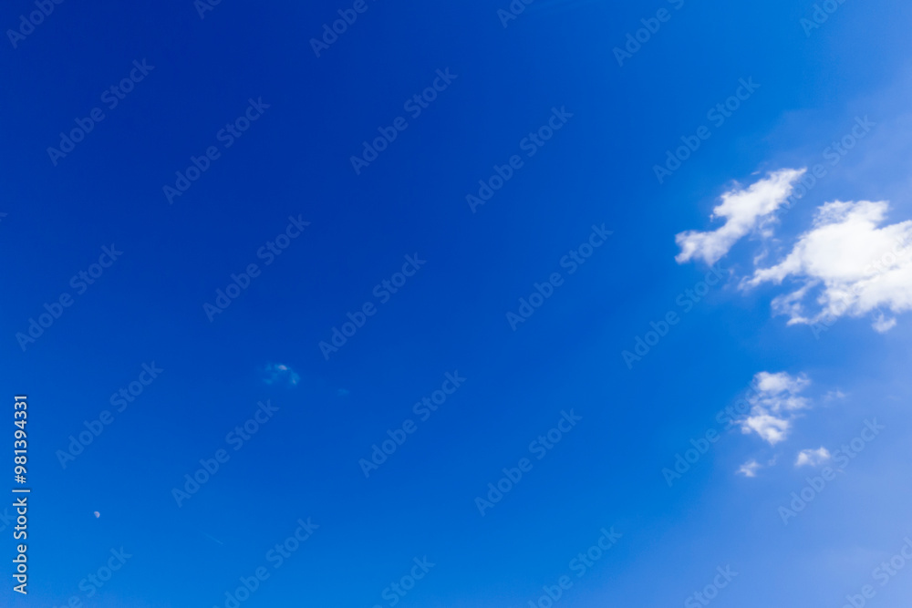 A clear blue sky with soft, fluffy clouds illustrating a serene atmosphere, perfect for backgrounds and nature-themed projects. A clear blue sky with soft, fluffy clouds illustrating a serene atmosphere, perfect for backgrounds and nature-themed projects.