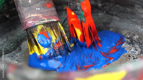 close-up blending paint with brushes