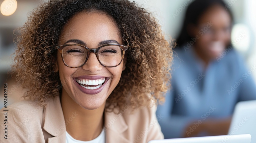 A woman with curly hair is smiling and wearing glasses A woman with curly hair is smiling and wearing glasses