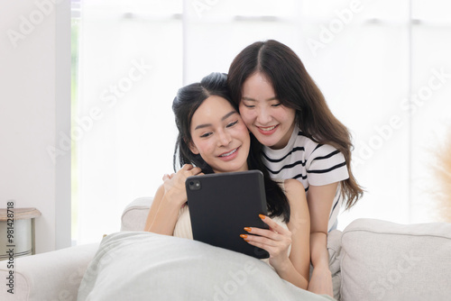 Asian woman watch tablet on sofa