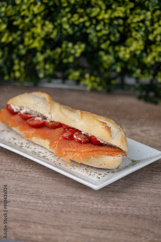 smoked salmon sandwich on a plate at a deli