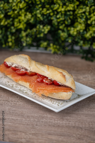 Obraz na płótnie smoked salmon sandwich on a plate at a deli w salonie
