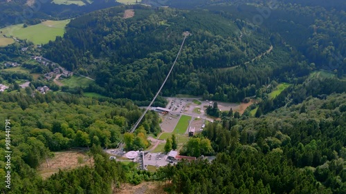 Aerial drone footage of Skywalk Willingen, the longest suspension bridge in Germany, located close to Winterberg in Sauerland photo