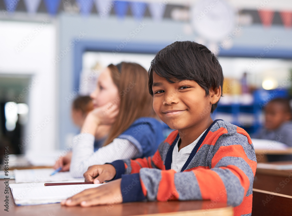 Portrait, smile and boy in classroom for education in growth, child development and notebook for lesson. Happy, learning and face of student with exam notes, knowledge and study at elementary school Portrait, smile and boy in classroom for education in growth, child development and notebook for lesson. Happy, learning and face of student with exam notes, knowledge and study at elementary school