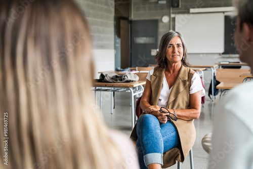 Εκτύπωση καμβά High school counselor in conversation with group of students offering guidance and support