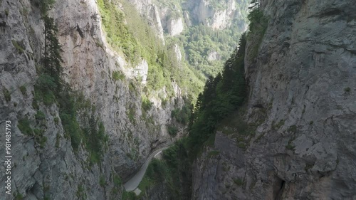Camera moving forward over bicaz gorge revealing winding road