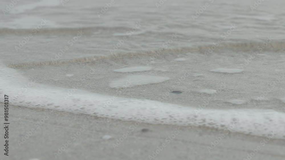 Sea waves running across the sand with foam. Sea waves running across the sand with foam.