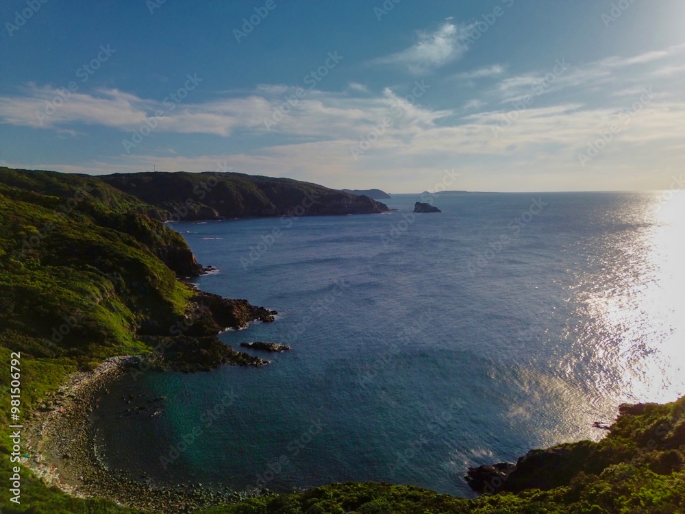 Fototapeta premium Experience the Breathtaking Coastal View with Lush Green Hills That Will Truly Inspire You