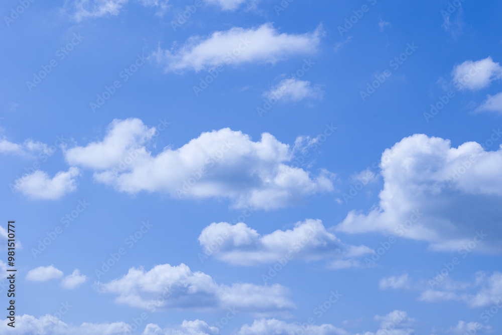 Fototapeta premium A Serene and Beautiful Blue Sky, Vastly Decorated with Fluffy, White, Cumulus Clouds Above