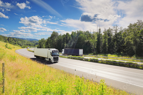 Large Transportation Truck on a highway road through the countryside