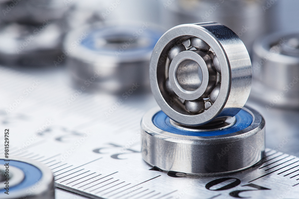 Obraz premium different bearings on a metal background. Part of mechanism.