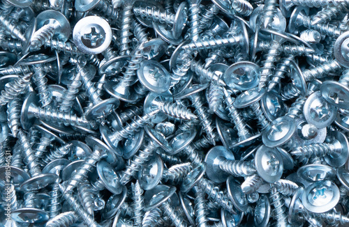 Self-tapping screw made of zinc metal texture background texture. Macro shot self-tapping screw pattern.
