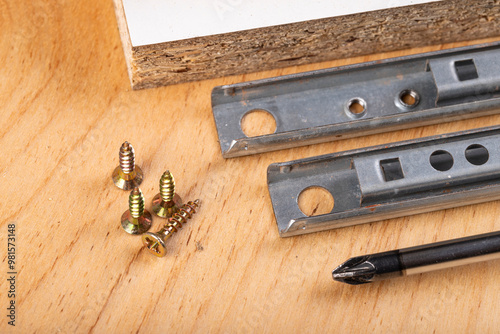 Metal sliding rails for mounting drawers in furniture.