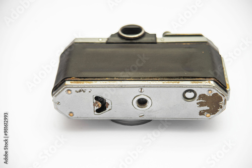 Poorly treated photo camera destroyed by time damaged broken