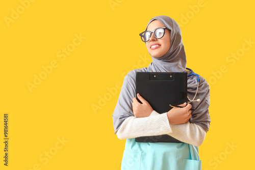 Young Muslim doctor with cl...