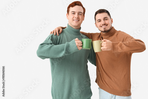 Young men with cups of tea ...