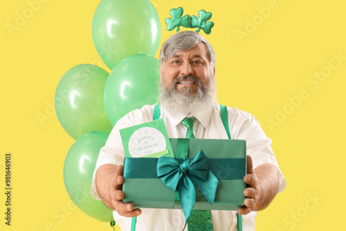 Mature man with gift box an...