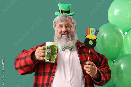 Mature man with beer and ba...