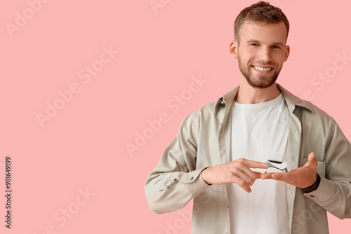 Young man with pulse oximet...