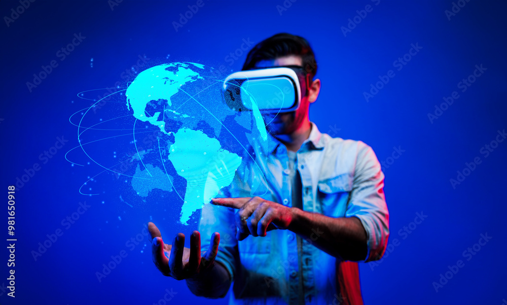 Smart man using VR goggle to connect global network connection. Happy man with casual cloth access futuristic global cloud computing server or software by wearing visual reality headset. Deviation. Smart man using VR goggle to connect global network connection. Happy man with casual cloth access futuristic global cloud computing server or software by wearing visual reality headset. Deviation.