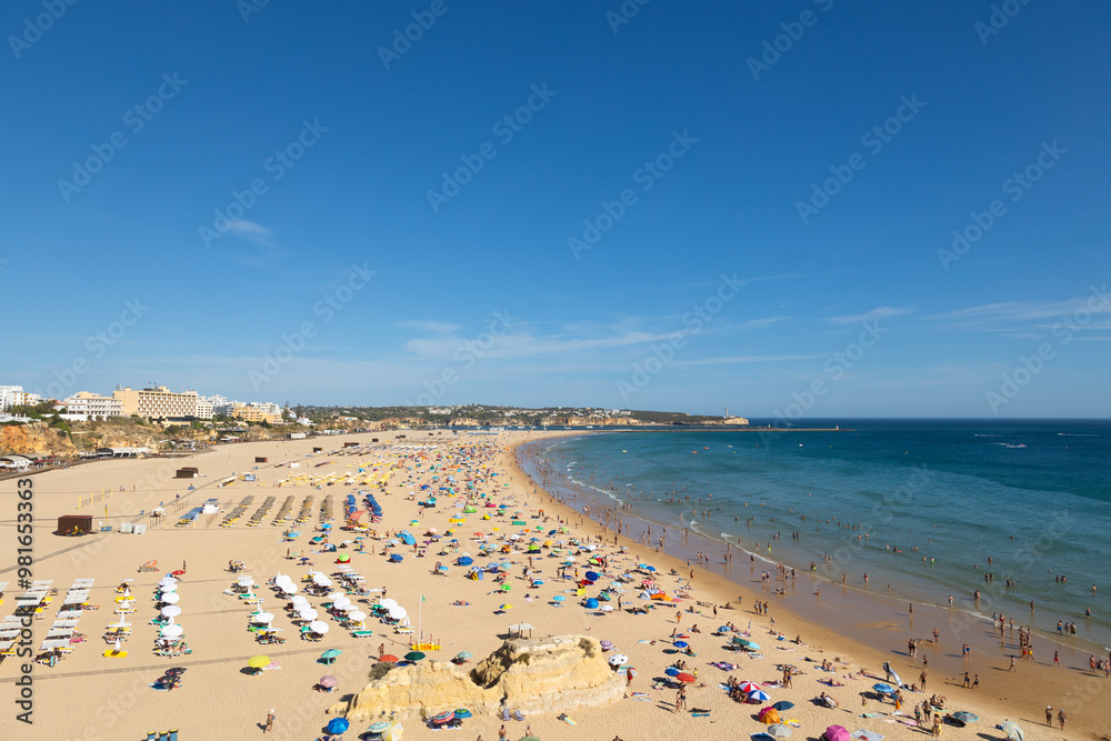 Praia da Rocha in Portimão, Algarve, Portugal, offers golden sands, clear blue waters, and stunning rock formations. A popular tourist destination for sunbathing, swimming, and seaside activities. Praia da Rocha in Portimão, Algarve, Portugal, offers golden sands, clear blue waters, and stunning rock formations. A popular tourist destination for sunbathing, swimming, and seaside activities.