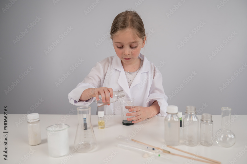 Caucasian girl doing chemical experiments on a white background. Caucasian girl doing chemical experiments on a white background.