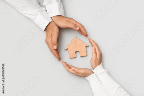 Couple with house figure on...