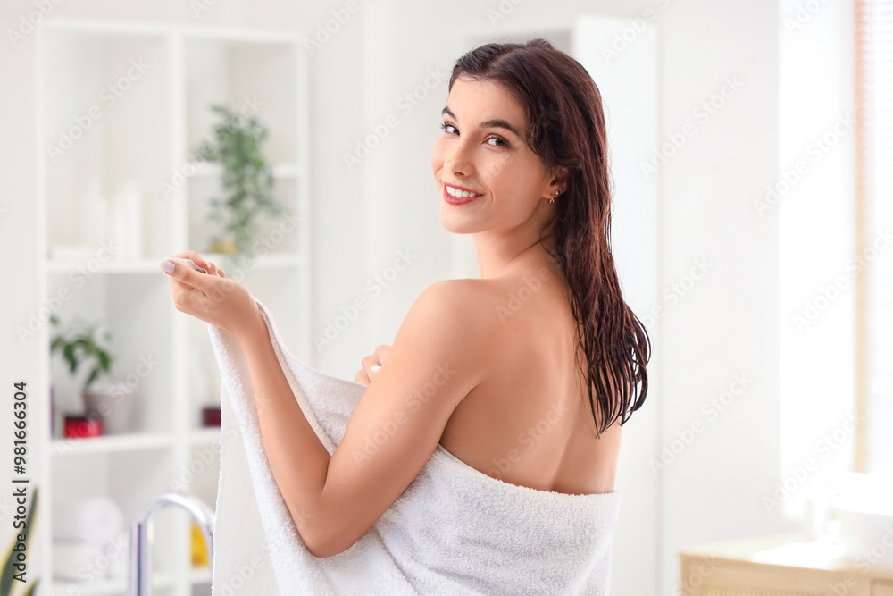 Beautiful young happy woman with towel after shower at home Beautiful young happy woman with towel after shower at home