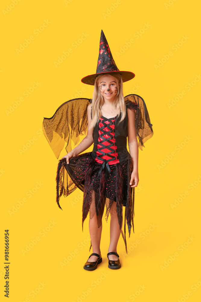 Obraz premium Cute happy girl dressed as witch for Halloween party on yellow background
