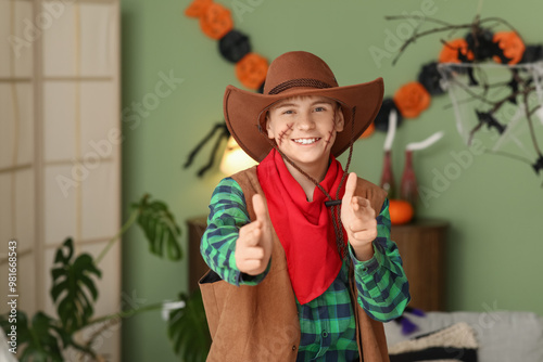 Smiling boy in cowboy hallo...