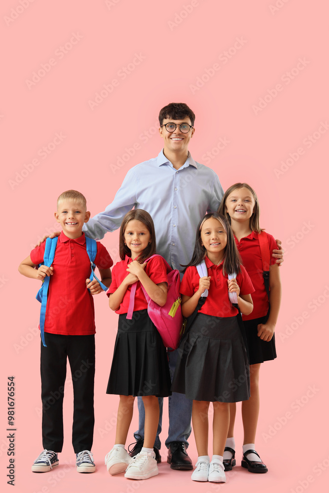 Male teacher with little pupils on pink background Male teacher with little pupils on pink background