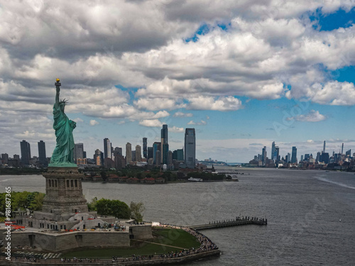 Panoramic aerial view Statue of Liberty in New York City, NY, USA. The Statue of Liberty over the Panorama of NYC. New York city skyline with statue of Liberty. The statue of Liberty and Manhattan.