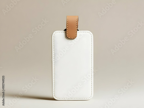 Elegant white luggage tag with leather strap, perfect for travel enthusiasts and stylish organization. photo