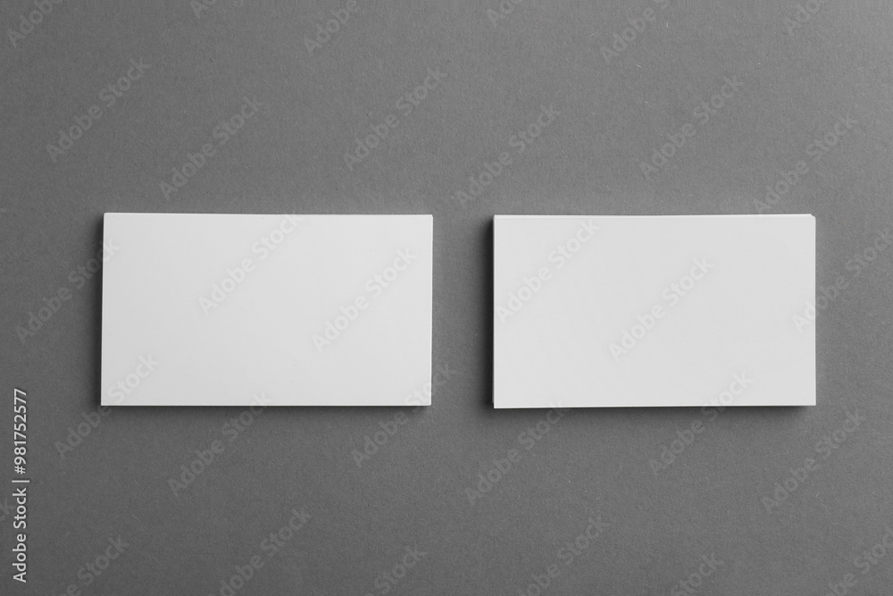 Blank business cards on grey background, top view. Mockup for design Blank business cards on grey background, top view. Mockup for design