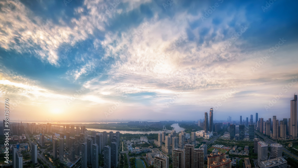 Fototapeta premium Captivating Urban Sunset Over a Modern City Skyline