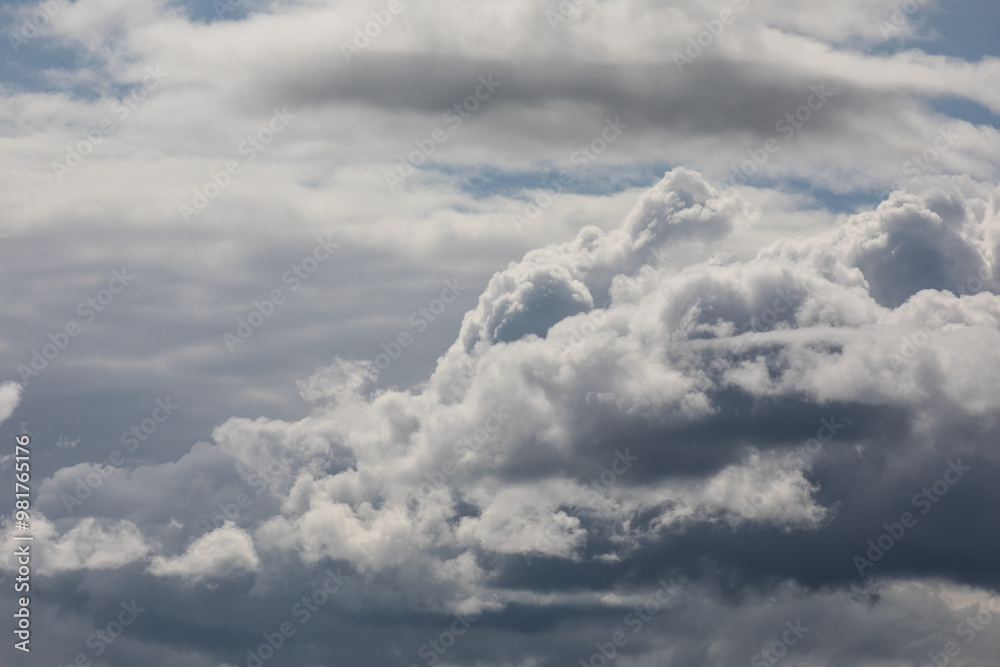 Photograph of white and grayish clouds covering the whole sky multiple types of clouds wispy thin and puffy overcast day. Photograph of white and grayish clouds covering the whole sky multiple types of clouds wispy thin and puffy overcast day.