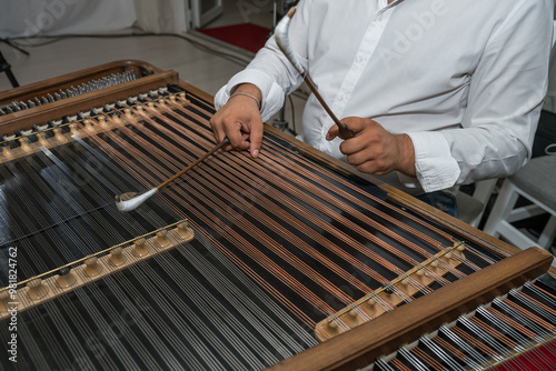 How to Choose a Hammered Dulcimer, A musician plays the Dulcimer  at a wedding in Romania photo