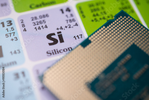 Clouse up Si (Silicon) in the periodic table with CPU computer. Silicon is most widely used semiconductor in electronic industry. US versus China chip war or tech war, microchip semiconductor concept.