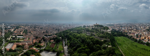 Aerial view of Brescia medieval castle, city center, city walls, bastions, vineyards in Lombardy Italy