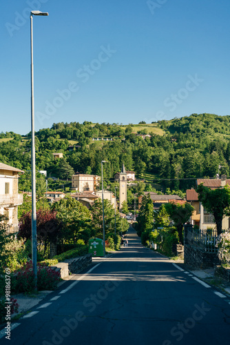 Sentiero degli Dei. Village and wind wind turbine along the Path of the Gods. San Benedetto val di Sambro, Bologna Province, Emilia Romagna, Italy. photo