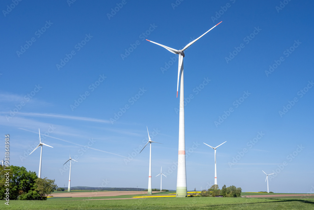 Modern wind energy plants with green fields seen in Germany Modern wind energy plants with green fields seen in Germany