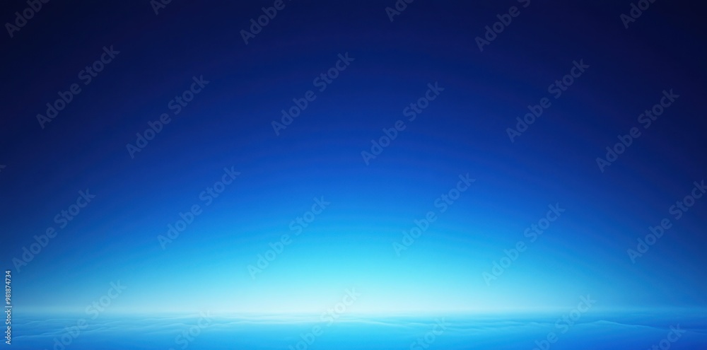 A Gradient Blue Sky Over a Distant Horizon of Clouds A Gradient Blue Sky Over a Distant Horizon of Clouds