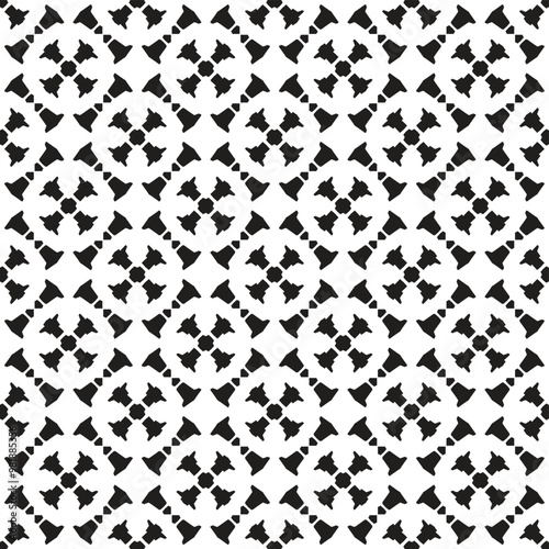 A repeating geometric pattern featuring abstract shapes in black and white, suitable for backgrounds or decorative purposes.