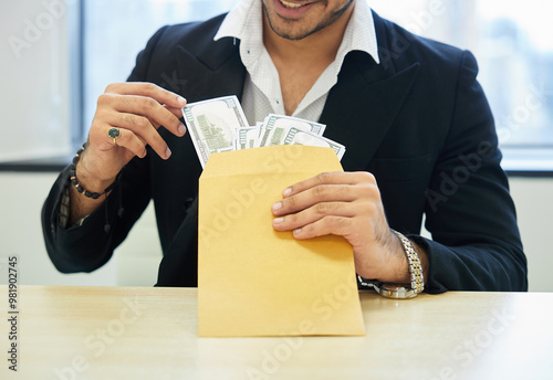 close up the man counting money from envelope on the table photo