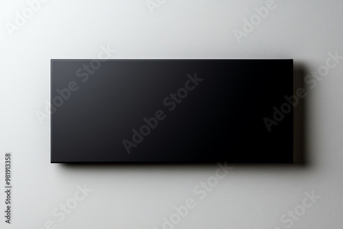Wallpaper Mural A minimalist black panel displayed against a gray background, perfect for modern design and creative projects. Torontodigital.ca