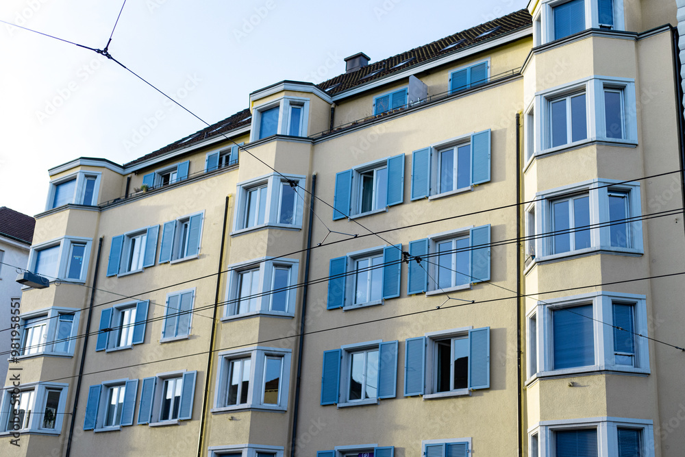 Obraz premium Yellow and blue building with tram rails in Zurich Switzerland.