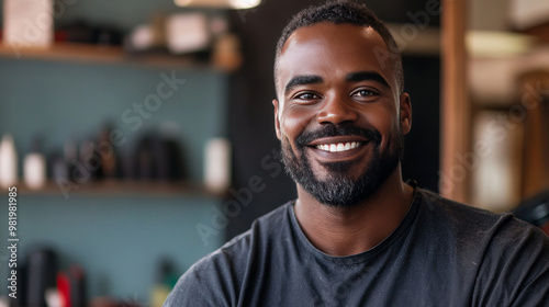 In the vibrant setting of a barber shop, a black man stands proudly with a smile, embodying the spirit of entrepreneurship. He holds a hair clipper, showcasing his skill and dedication as a profession