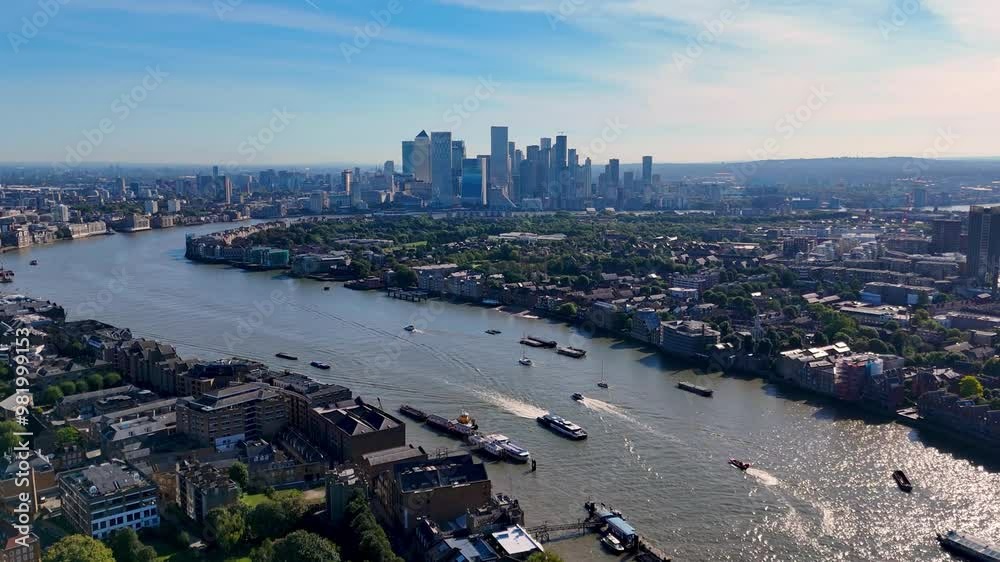 A breathtaking aerial view of the River Thames and Canary Wharf, with a ...