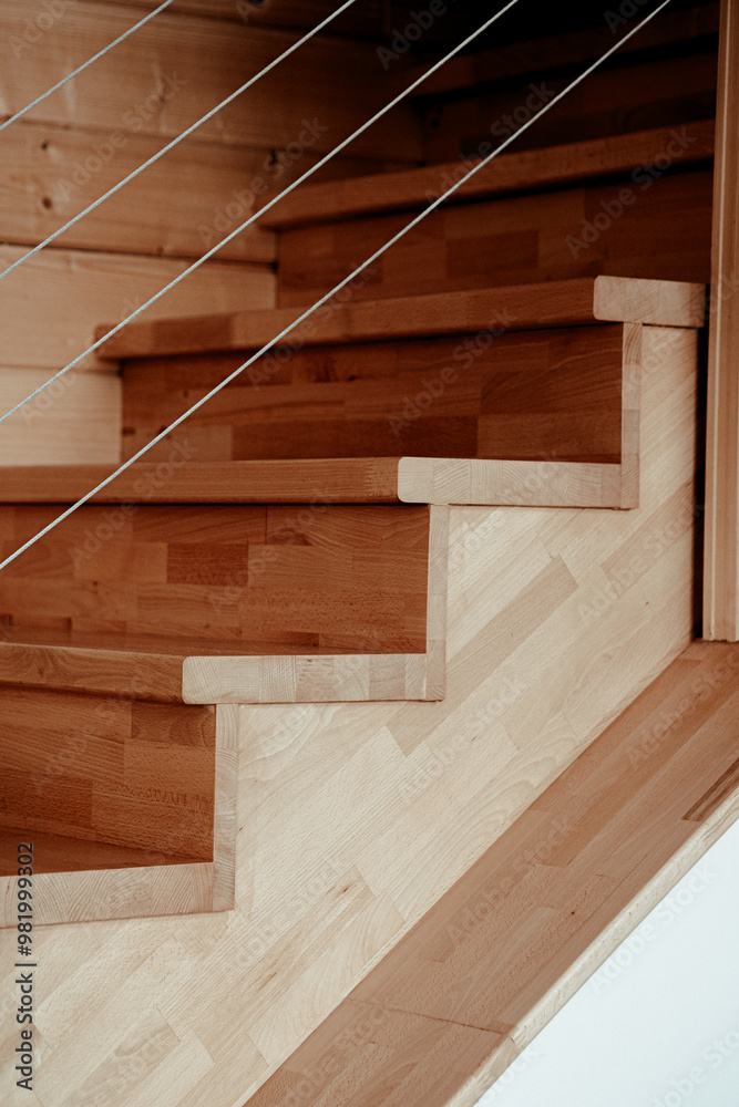 Elegant wooden staircase with minimalist design in a modern home, showcasing natural light and clean lines Elegant wooden staircase with minimalist design in a modern home, showcasing natural light and clean lines
