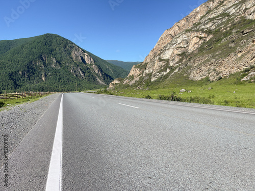 Rural landscape road in the mountains, photo as background, digital image.